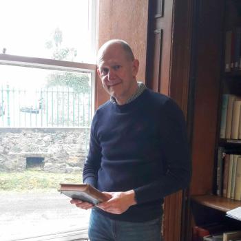 Andy Graves of Sycamore Bookbinding standing by a window