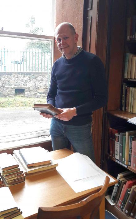 Andy Graves of Sycamore Bookbinding standing by a window